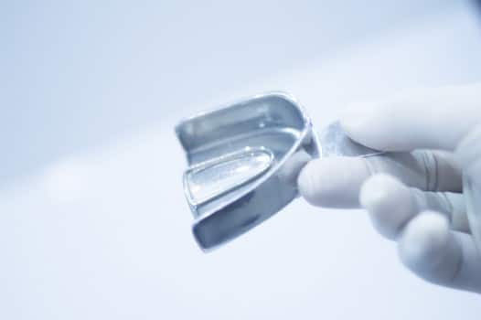 Metal mold tray for taking teeth impression