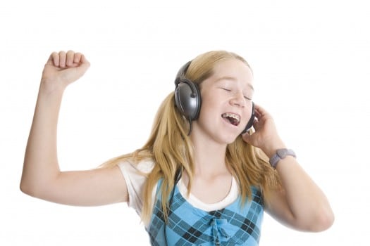 Girls with braces listening to music and singing