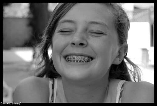 Girl smiling with orthodontic braces