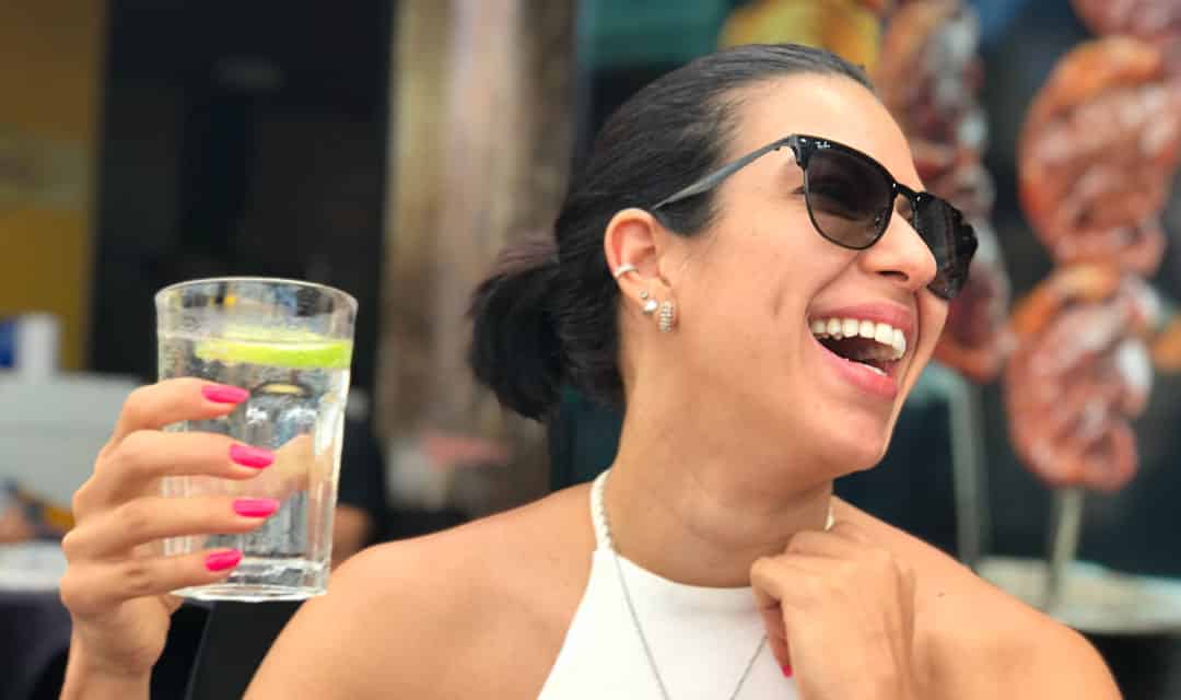 Person at a restaurant drinking water